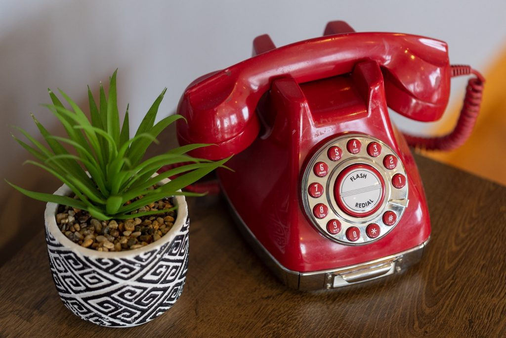 Retro phone at Stardust Retro Retreat - A Mid-Century Modern vacation rental in Coleman, Texas - 3 bedrooms on 2 acres